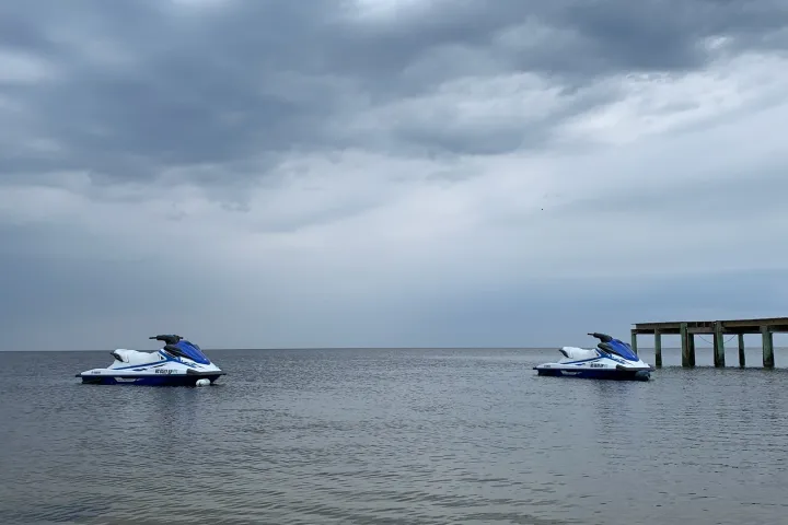a boat sitting next to a body of water